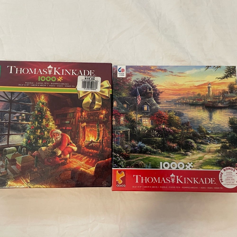 Bundle of 2 Thomas Kinkade 1000 Piece Puzzles. Christmas Santa & Sunset Cottage